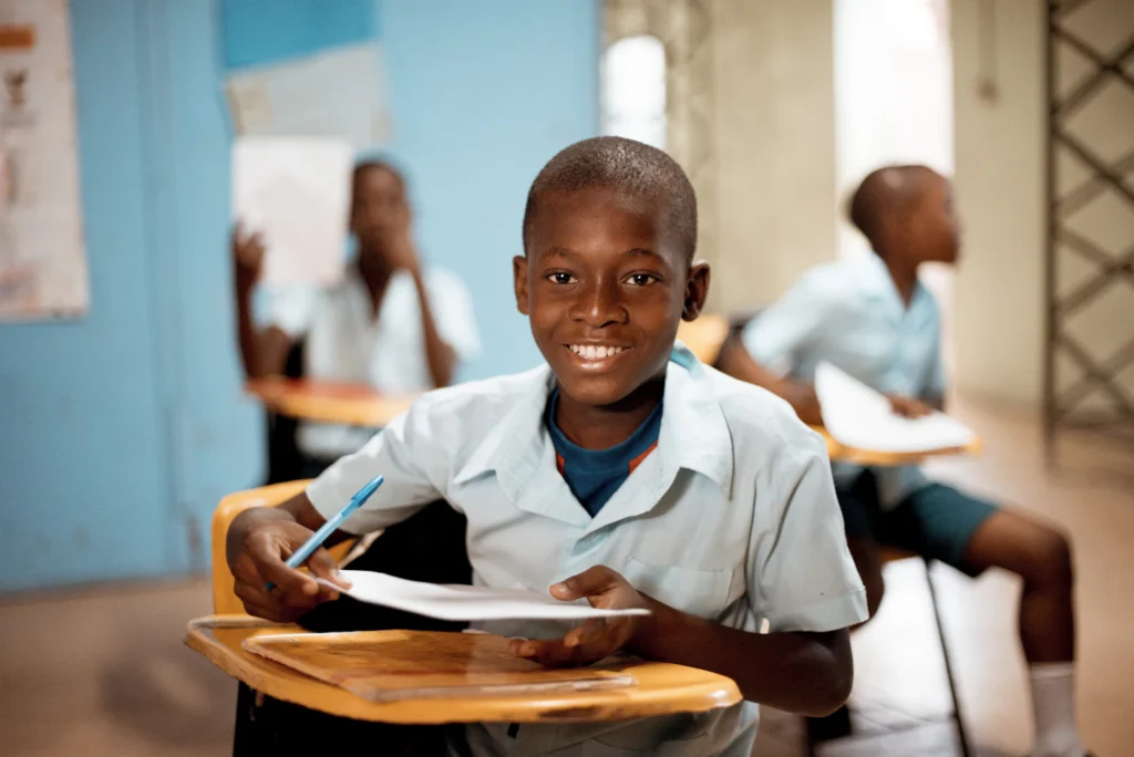 Secondary school boy holding his papers
