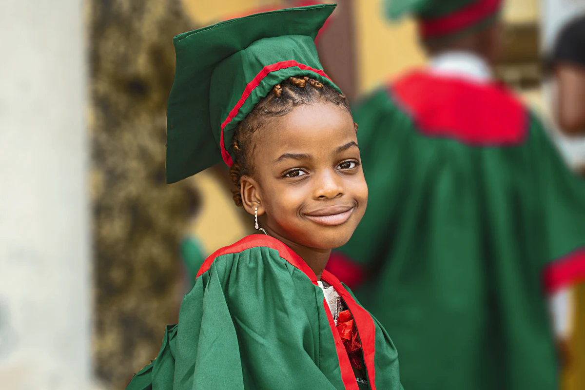 Graduate in a green academic gown