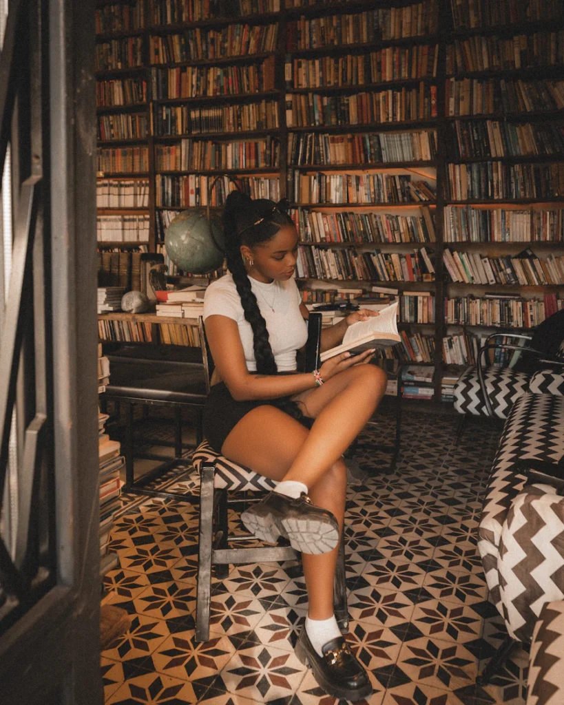 Young woman reading in a library
