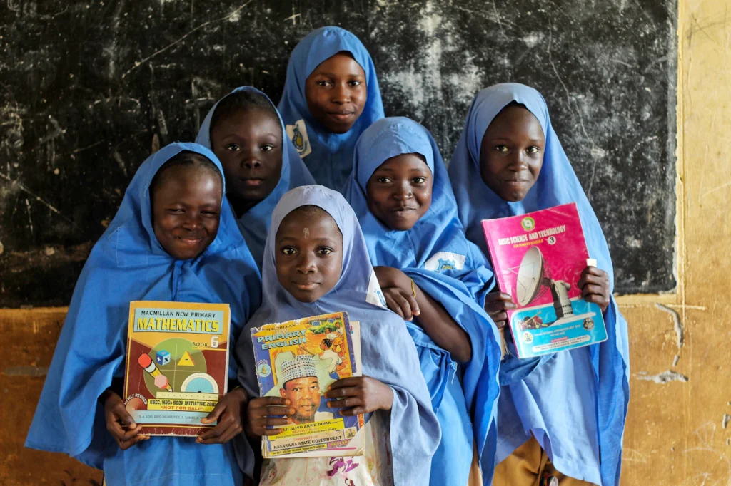 University students holding their books